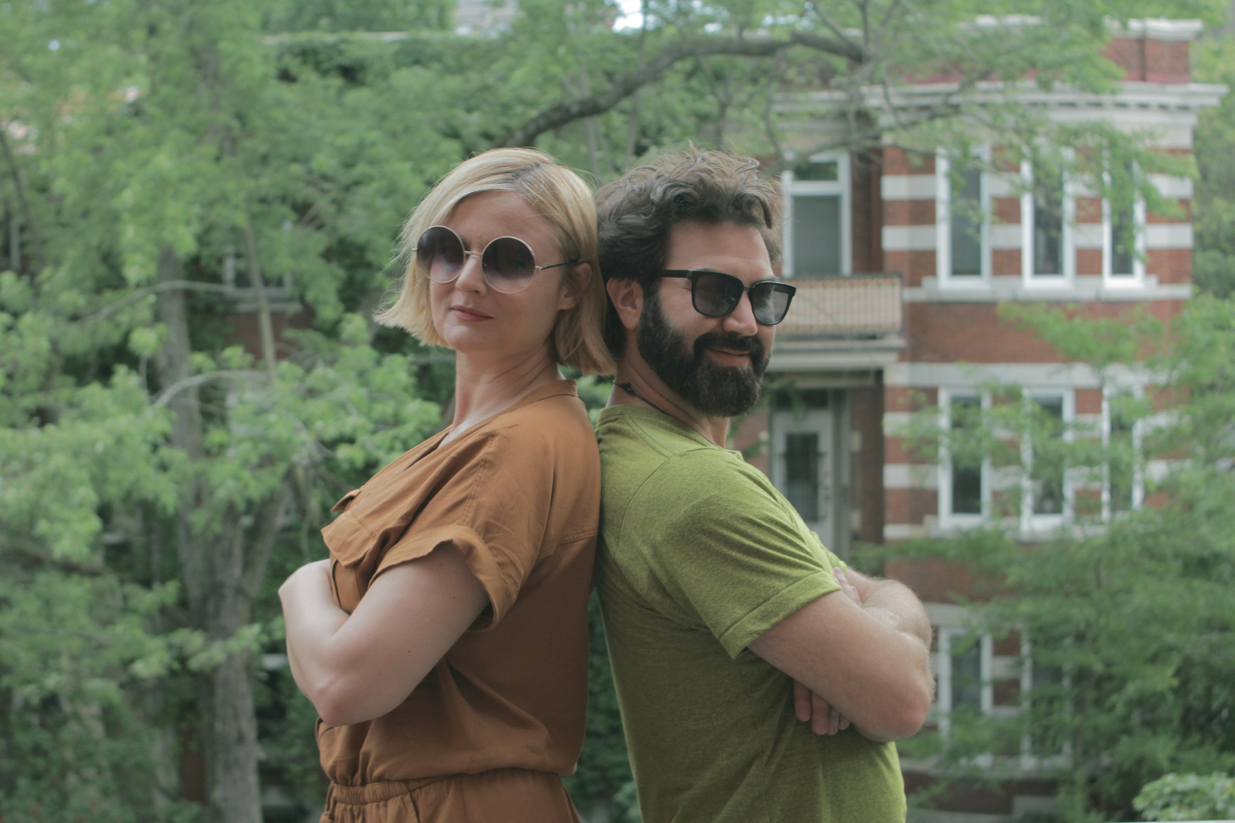 The Mile Enders — two leads standing back to back on a Montreal street